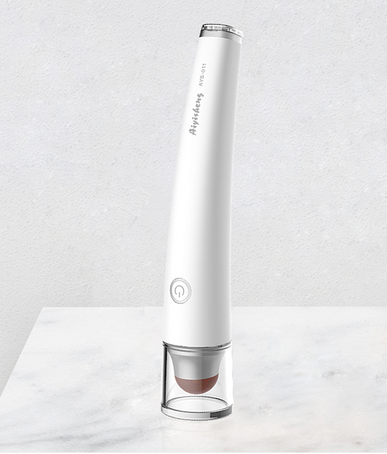 Aiyisheng Heated Bian Stone Eyes Massage Device displayed on marble surface for eye muscle relief and fatigue reduction.